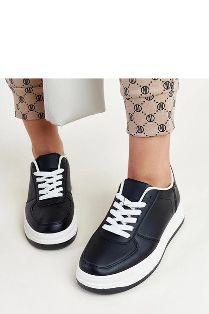 The Solea Cvita black platform sneakers styled elegantly with casual attire, emphasizing their trendy yet comfortable appeal.