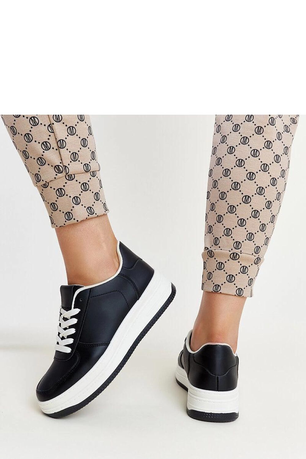 Detailed view of Solea Cvita sneakers featuring a rubber sole and intricate lace-up system, perfect for fashion-forward individuals.