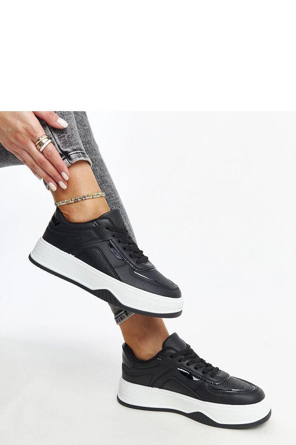 Elegant Solea black lace-up sneakers designed with a thicker sole, offering supreme comfort and exceptional grip, ideal for enhancing your daily style.