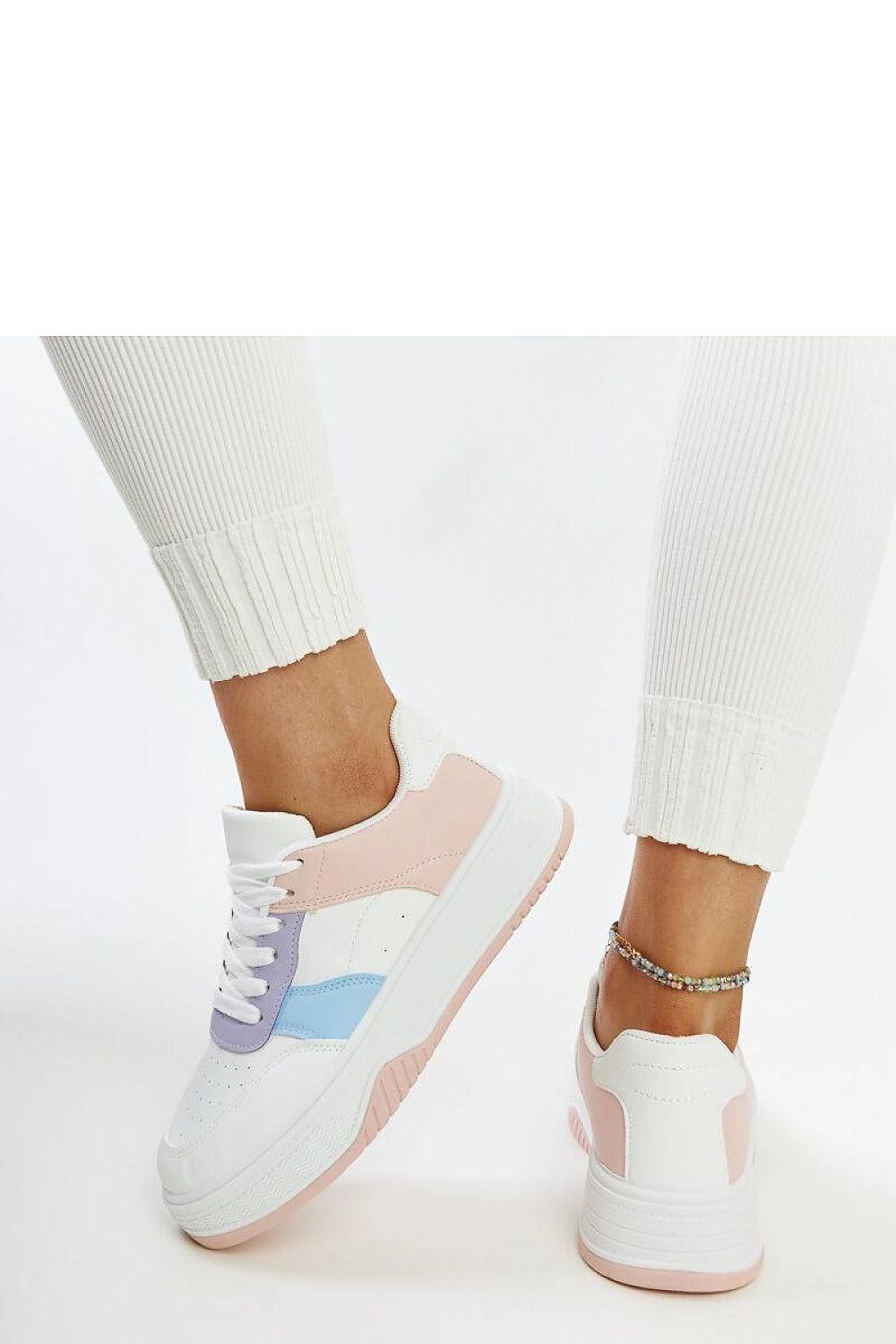 Solea eco leather sneakers showcasing a chic pink sole, ideal for fashionable enthusiasts seeking sustainable luxury.