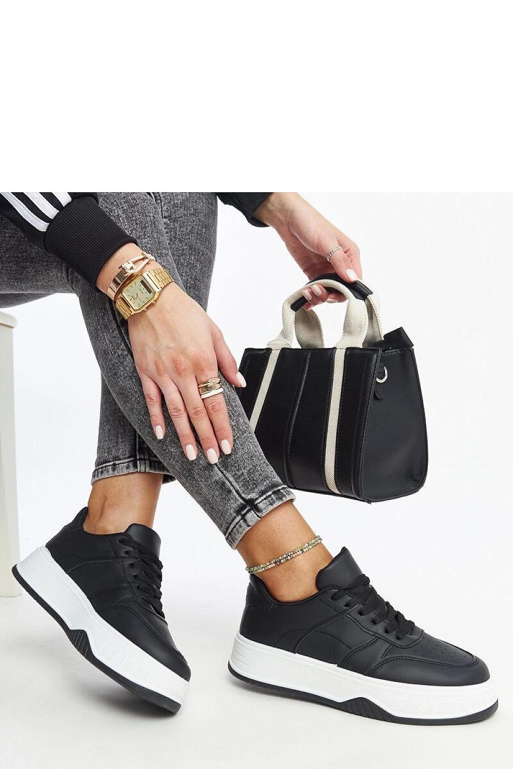 Chic black lace-up sneakers from Solea with a round toe design and eco-friendly faux leather for a luxurious look.