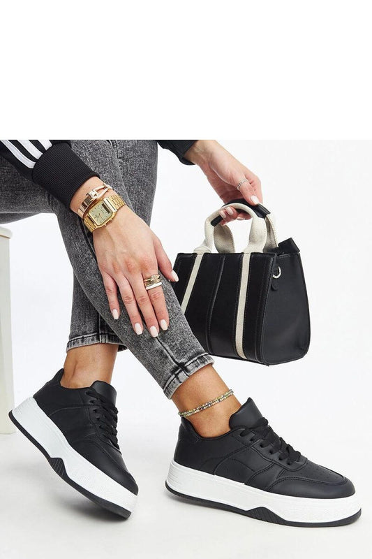 Chic black lace-up sneakers from Solea with a round toe design and eco-friendly faux leather for a luxurious look.