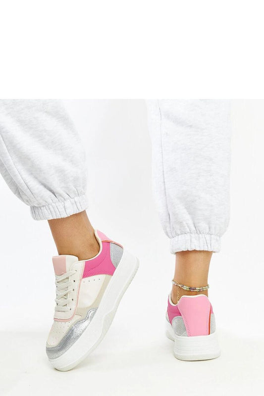Stylish close-up of Solea's white and pink chunky sneakers showcasing the eco leather texture and sophisticated design, ideal for a contemporary urban wardrobe.