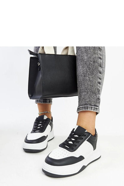 Chic Solea luxury sneakers showcasing a round toe and lace-up closure, embodying style and sophistication.