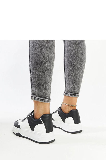 Luxury black and white sneakers with a thick rubber sole by Solea, showcasing a modern design and round toe for stylish and comfortable wear, available in EU sizes 36-41.