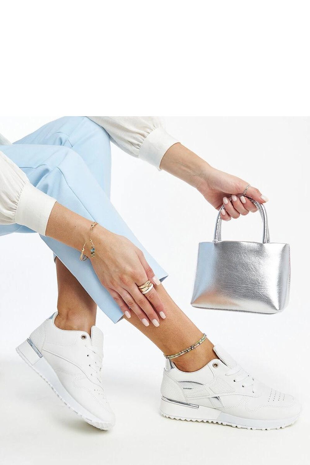 Elegant white sneakers by Solea featuring a luxurious snake skin pattern, ideal for stylish outfits.