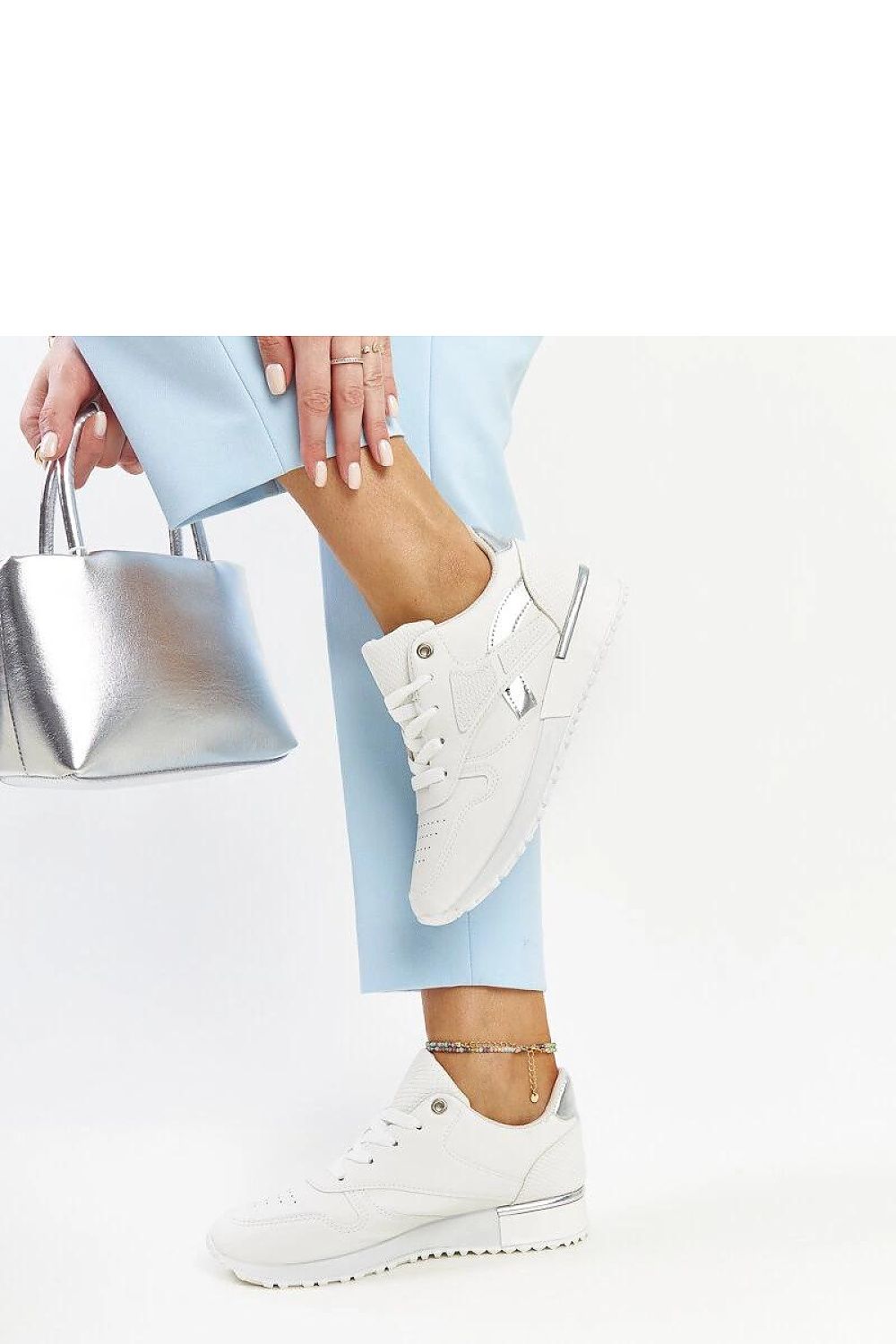 Solea's chic white sneakers showcasing a sophisticated snake skin print, suitable for every fashion-forward wardrobe.
