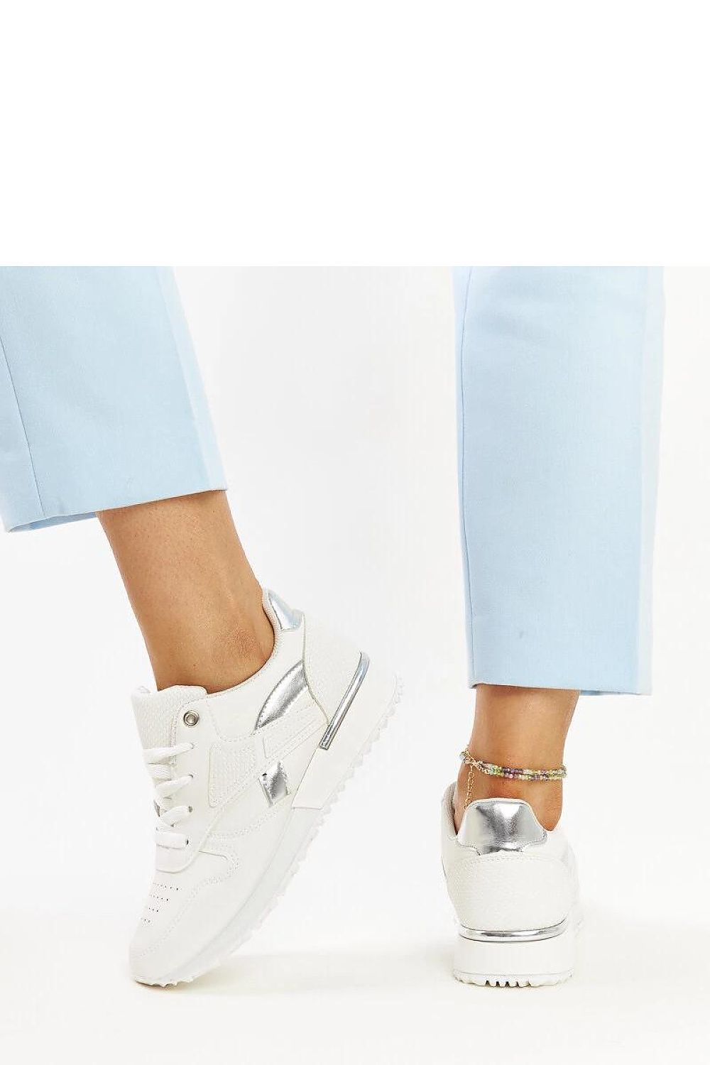 Elegant white sneakers with snake skin pattern by Solea, showcasing a stylish design perfect for fashionable outfits.