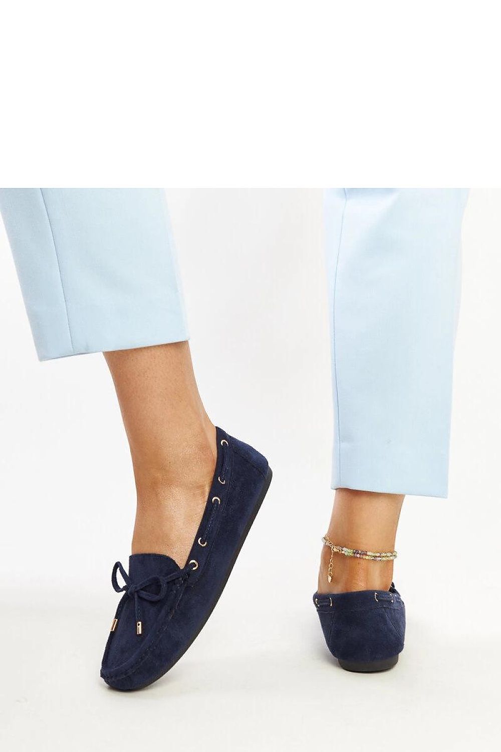 Close-up of the eco-friendly suede material of Solea's exquisite navy blue moccasins, showcasing their quality and luxurious texture.