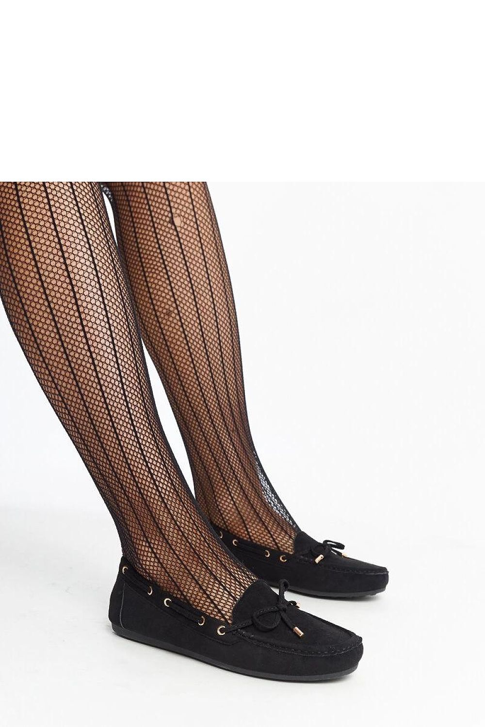 Stylish women wearing Solea navy blue suede moccasins, demonstrating their comfort and sophisticated look for casual outings.