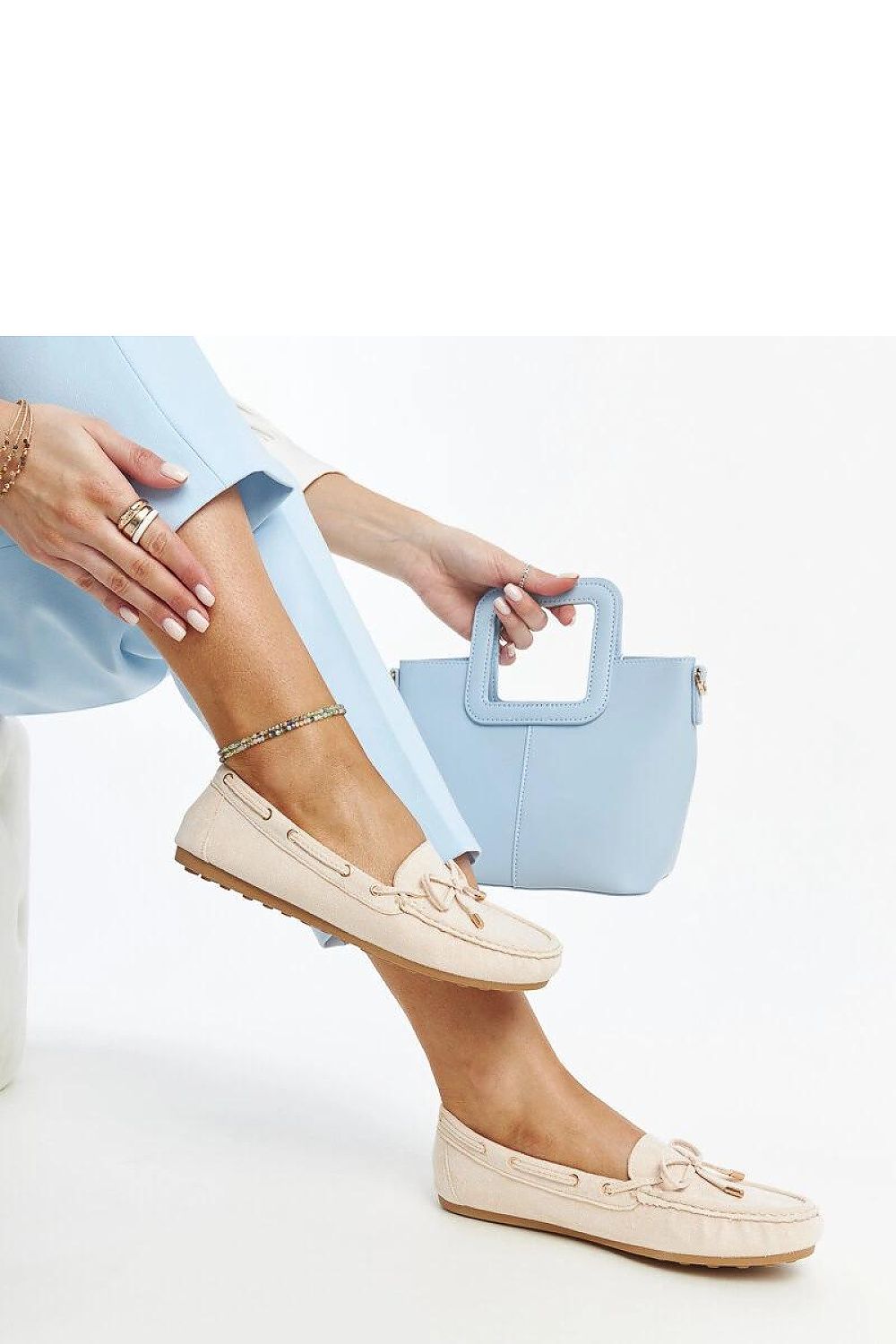 Luxurious navy blue suede moccasins for women by Solea, featuring a stylish slip-on design and almond-shaped toe, perfect for everyday elegance.