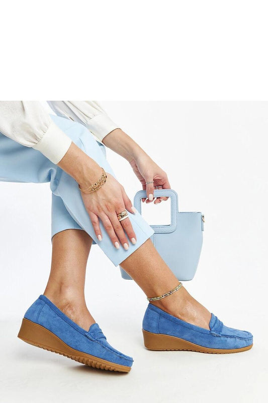 Luxurious blue suede loafers Sakena from Solea, showcasing an almond-shaped toe and a chic wedge, perfect for both casual and formal occasions.