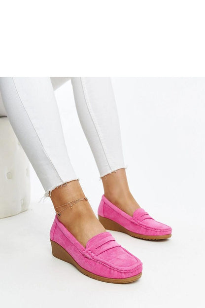 Sakena wedge loafers by Solea displayed on a stylish surface, accentuating their fashionable design and eco-friendly suede leather.