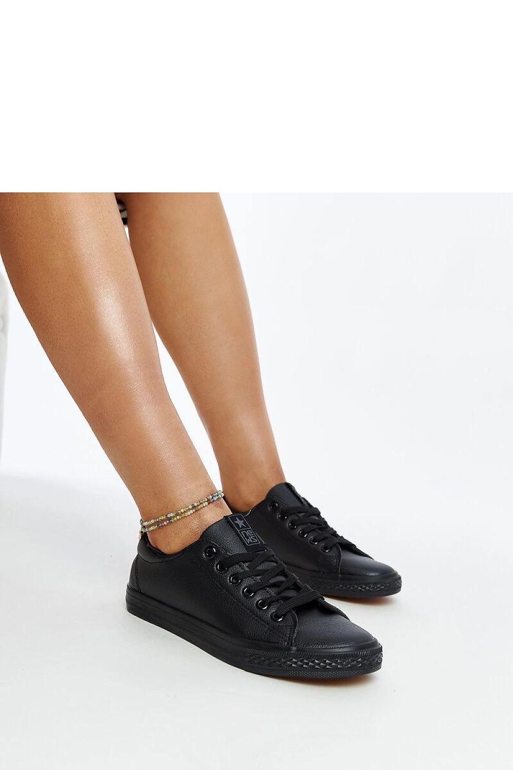 Luz Black eco-leather sneakers for women by Solea, showcasing stylish lacing and a comfortable rubber sole.