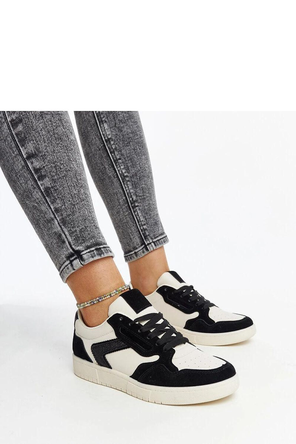 Solea black-and-white glitter sneakers for women, showcasing sleek low-cut design and round toe, perfect for stylish comfort.