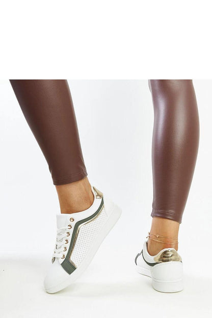 Close-up shot of Solea eco leather sneakers highlighting the intricate faux leather texture and stylish rubber laces.