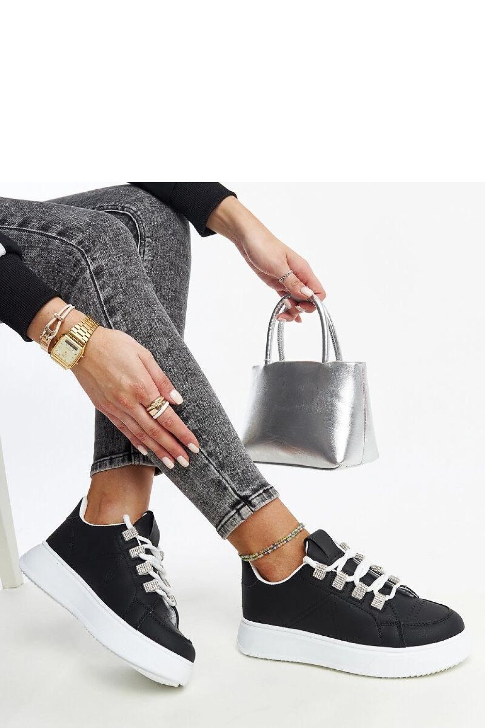 Close-up of Solea Black Eco Leather Sneakers showcasing the luxe faux leather material and modern lace-up closure, ideal for versatile daily wear.