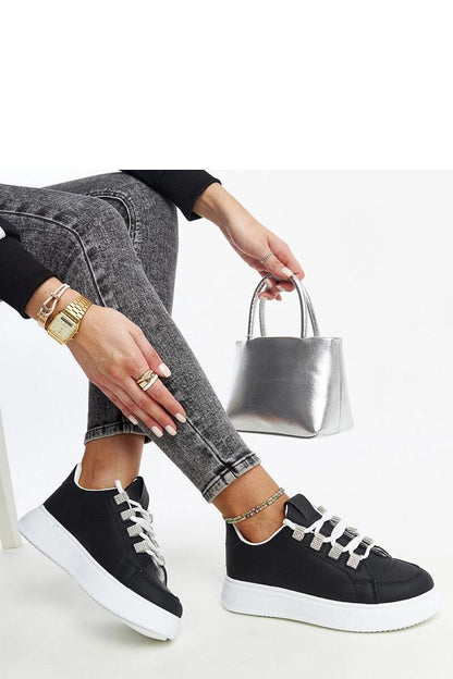 Close-up of Solea Black Eco Leather Sneakers showcasing the luxe faux leather material and modern lace-up closure, ideal for versatile daily wear.