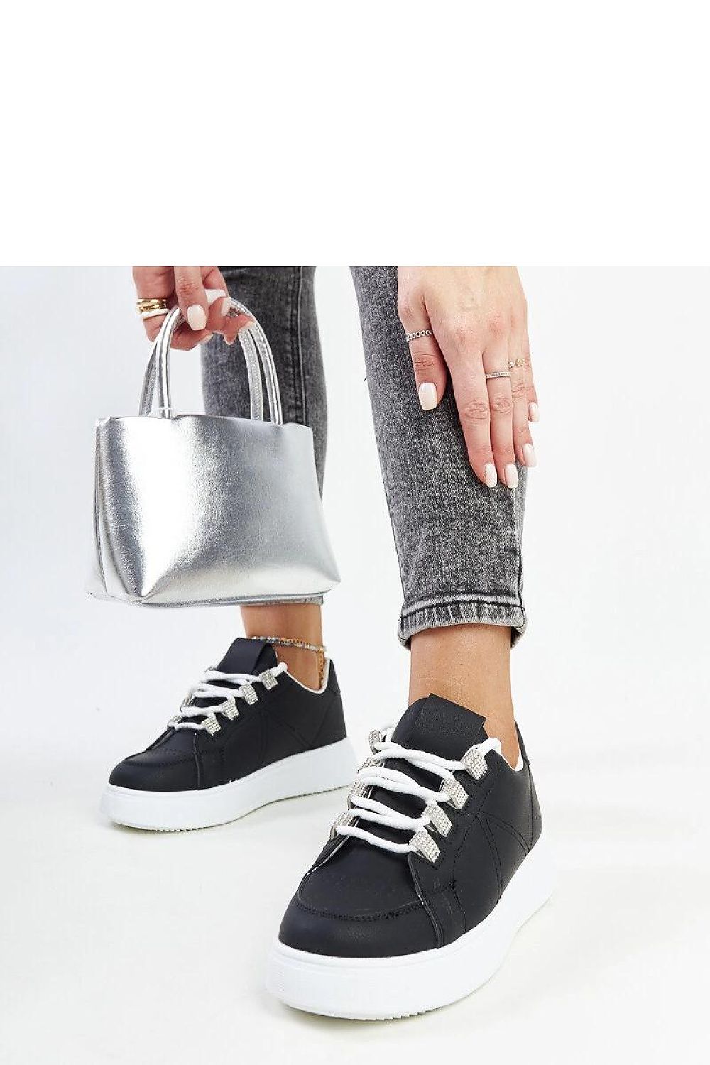 Solea luxurious black eco leather sneakers with thick sole, showcasing modern lace-up design for comfort and style.