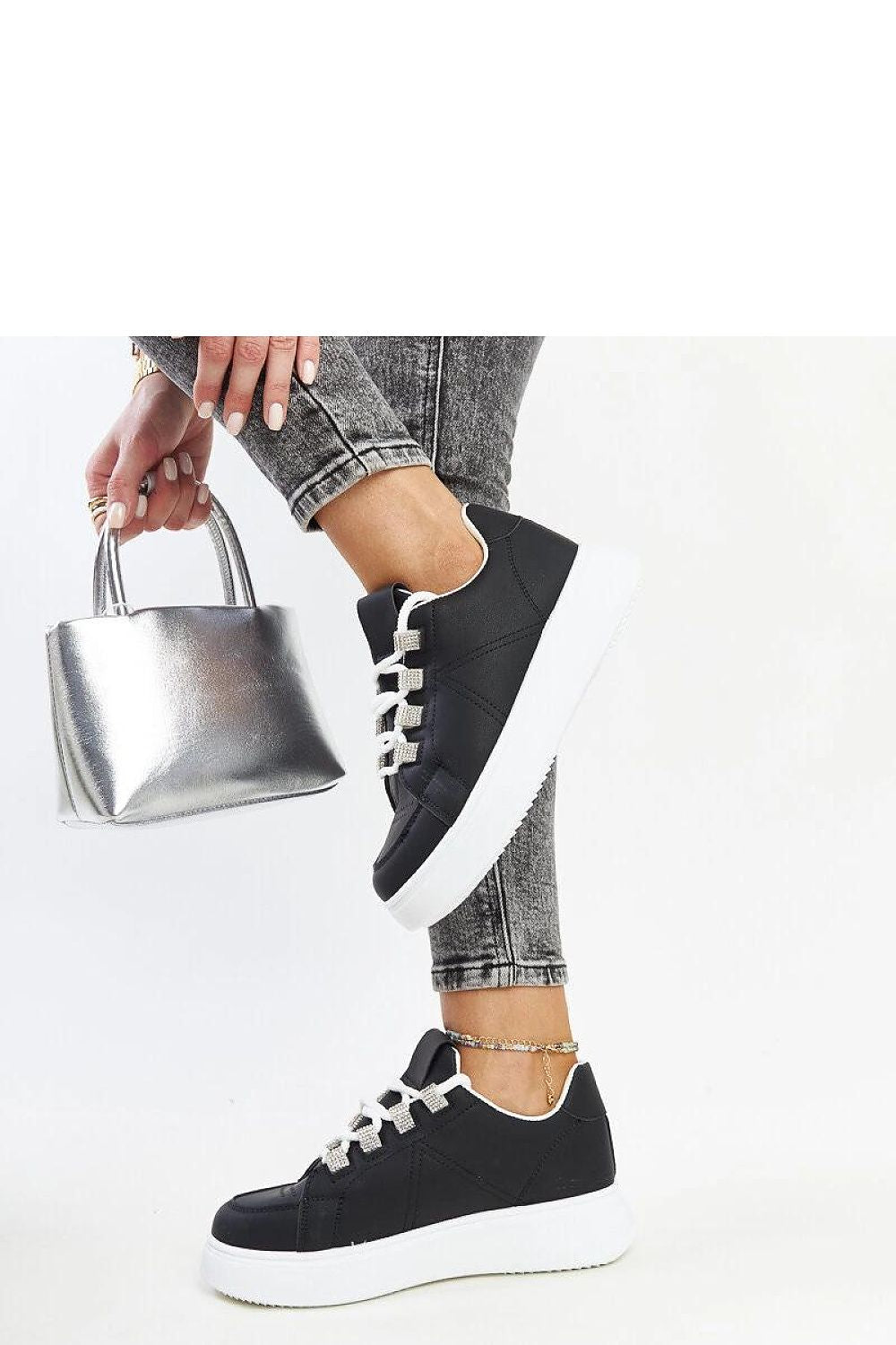 Stylish Solea black eco leather sneakers featuring a round toe and durable rubber sole, perfect for daily wear.