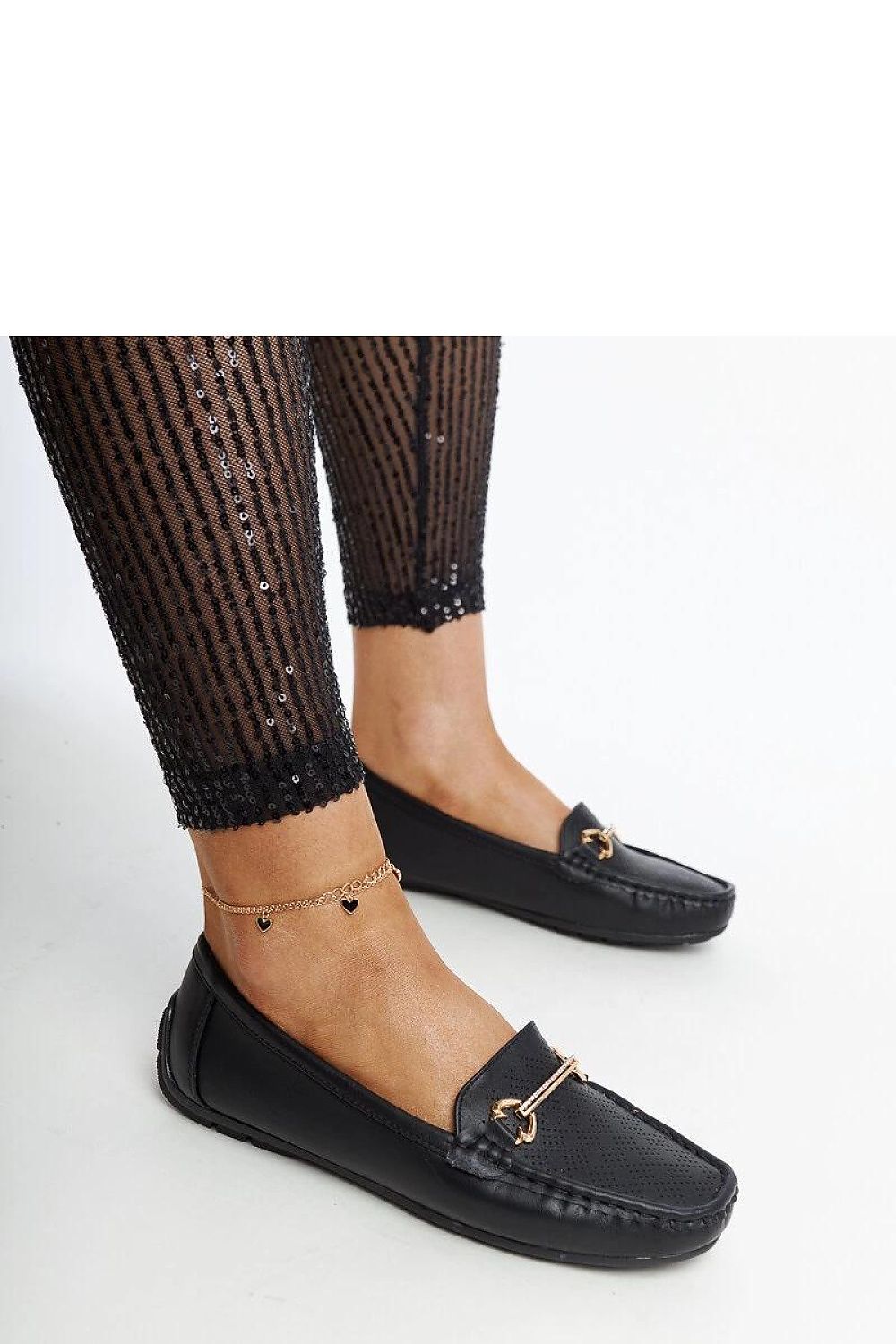 Elegant black slip-on loafers by Solea, featuring rhinestone buckle and almond-shaped toe, perfect for stylish women.