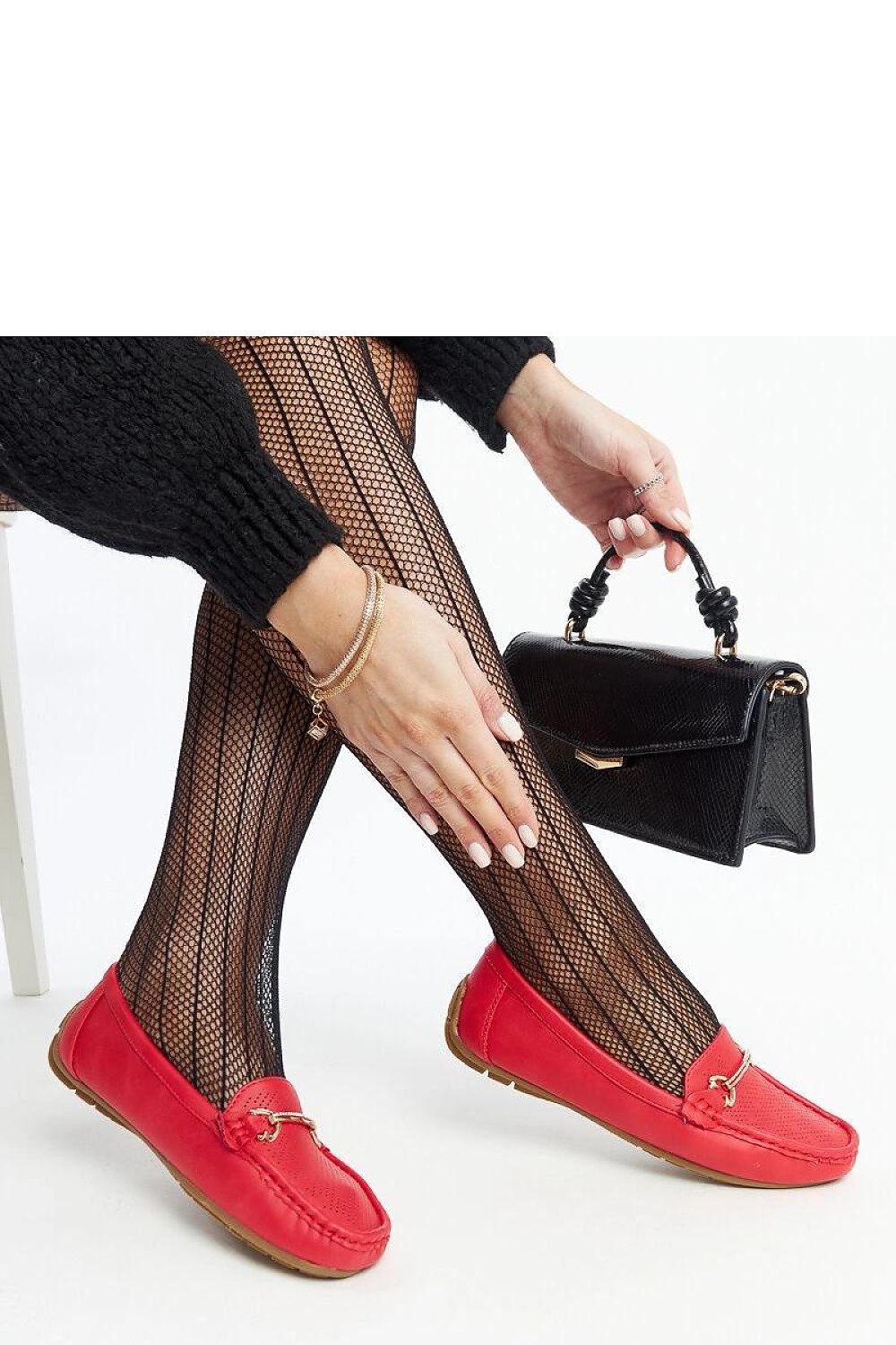 Luxury black slip-on loafers by Solea showcasing high-quality eco leather and a decorative buckle, ideal for elegant spring and summer wear.