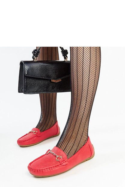 Stylish black slip-on loafers from Solea, designed with a low heel and decorative rhinestone buckle, embodying luxury and comfort.