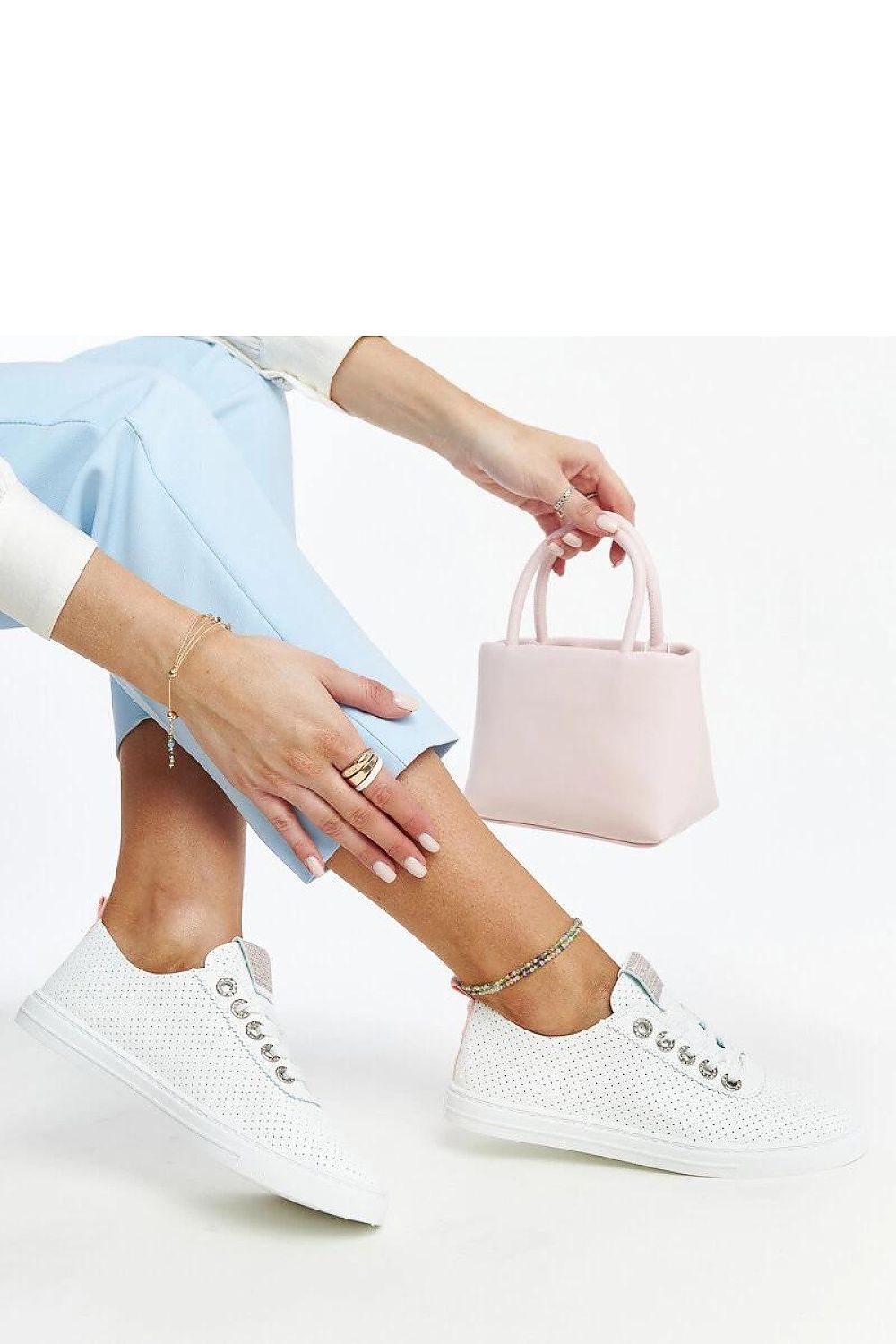 Luxury white eco-leather sneakers by Solea, showcasing a contemporary design with a round toe, perfect for summer style.