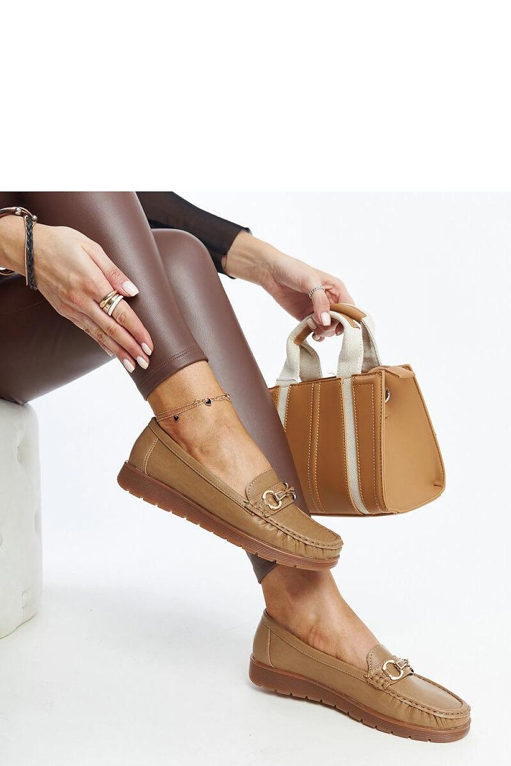 Solea black Anisah loafers displayed alongside outfit inspirations, demonstrating their versatility and chic style for spring and summer.