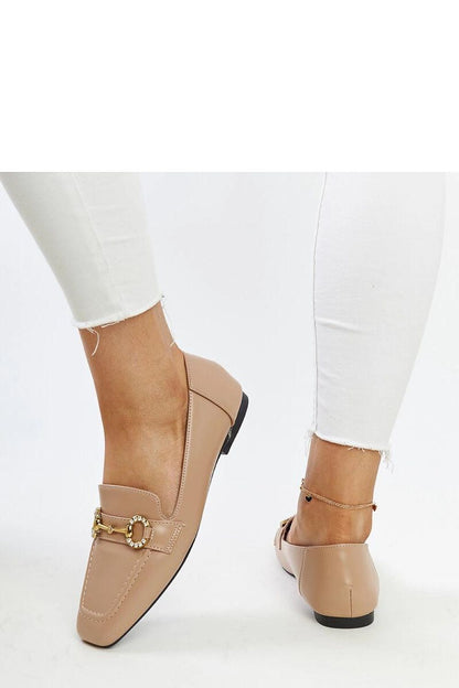 Stylish beige Areebah moccasins from Solea with black sole, ideal for adding a touch of elegance and comfort to any outfit during warmer seasons.