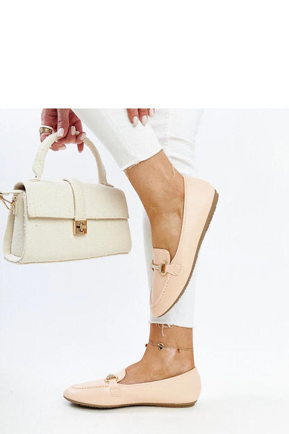 Close-up of Solea's luxury beige loafers, highlighting the rhinestone detailing and eco-conscious leather craftsmanship.