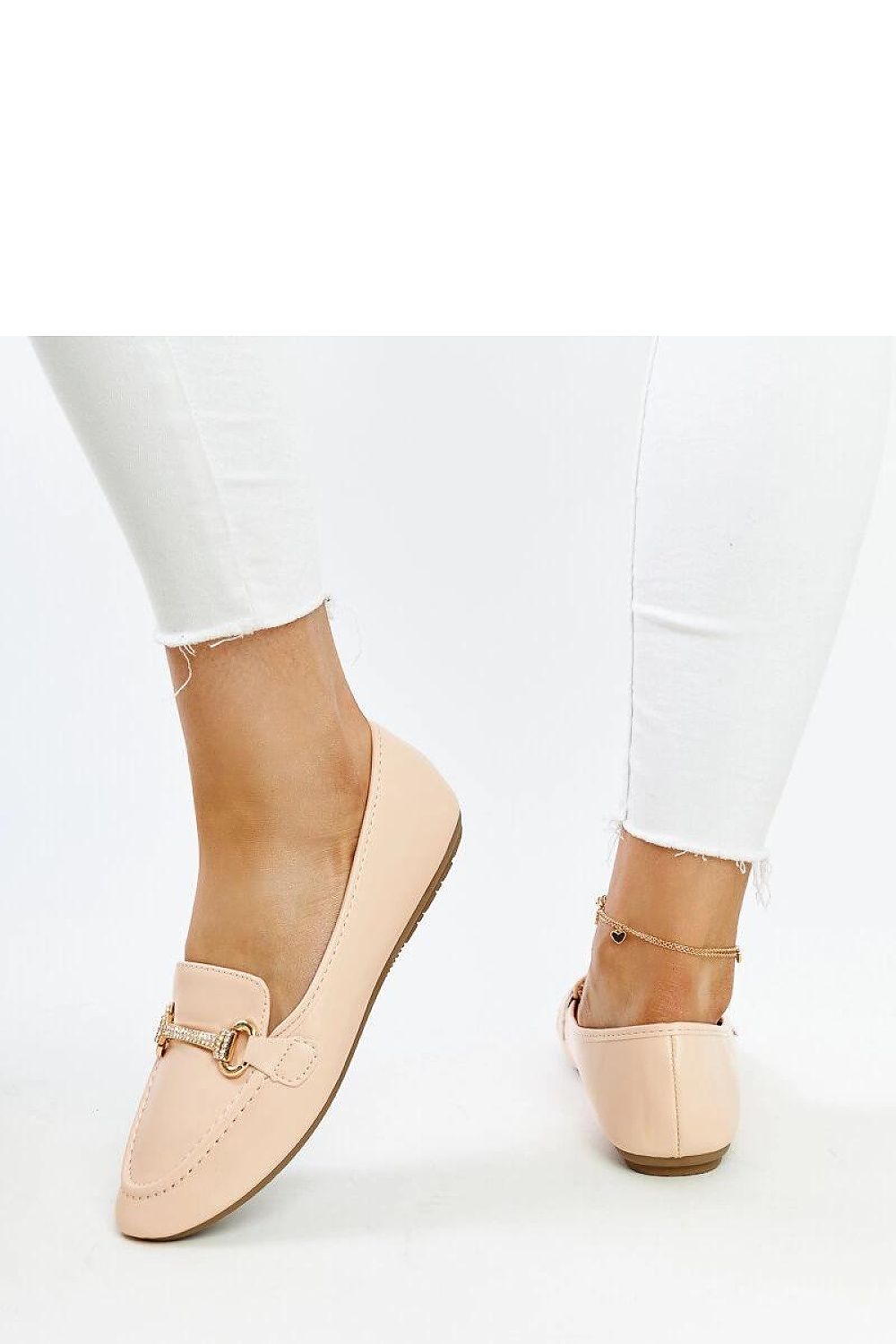 Solea's elegant beige Paddy loafers displayed on a summer backdrop, showcasing their comfort, style, and eco-friendly materials.