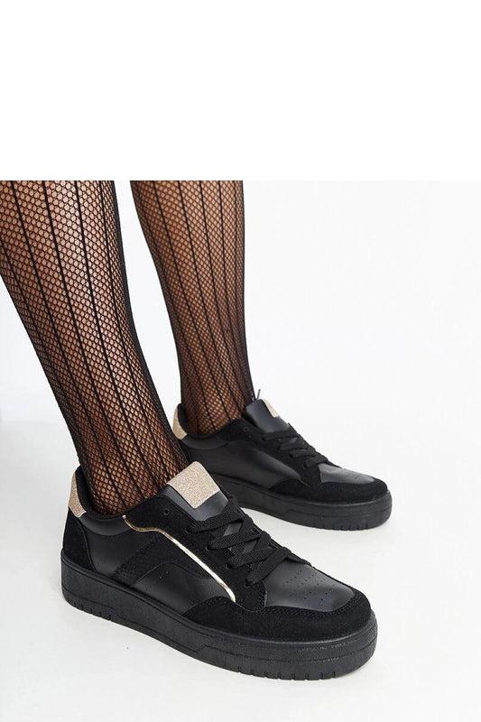 Luxury black platform sneakers by Solea featuring a sleek design, lace-up closure, and robust rubber sole, ideal for stylish everyday wear.