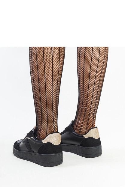 Elegant scene featuring Solea lace-up black platform sneakers, highlighting their perfect fit and chic aesthetic, perfect for spring and summer outings.