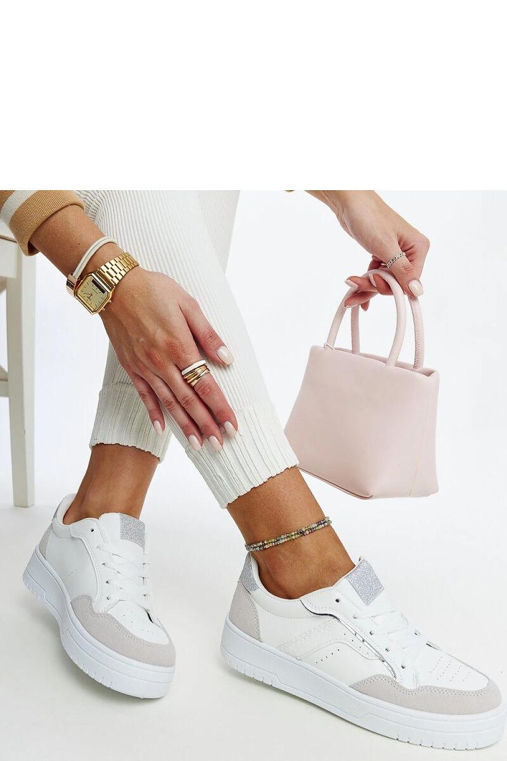 Lifestyle shot of Solea luxury black platform sneakers worn with fashionable attire, emphasizing their comfort and stylish rubber sole for modern fashion.