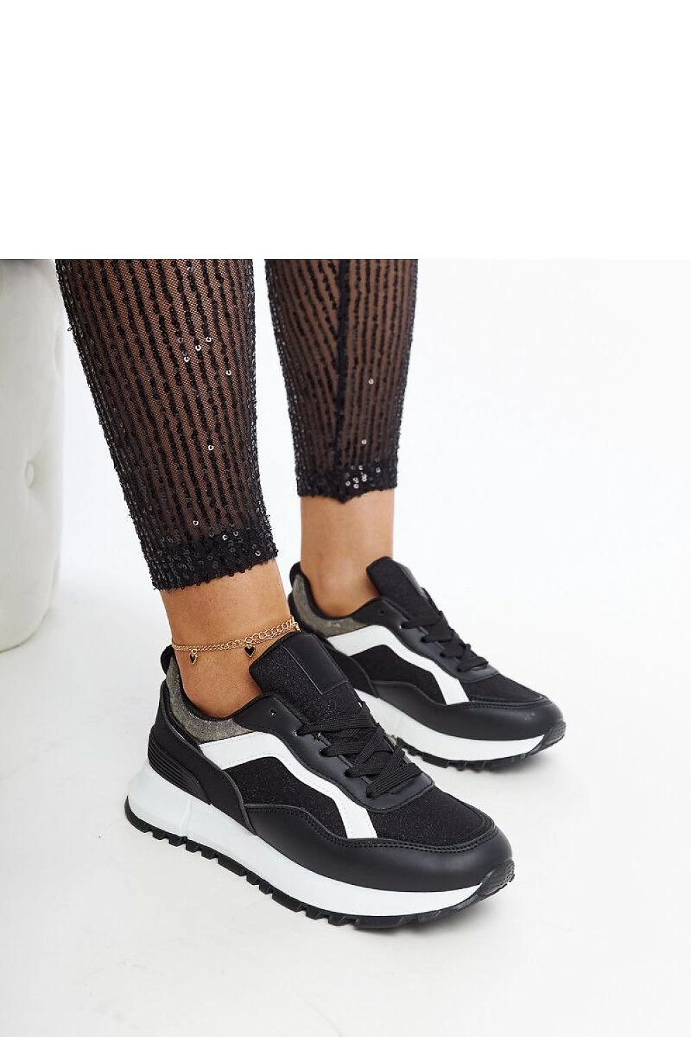 Luxury black glitter platform sneakers by Solea, featuring a stylish design perfect for urban casual wear.