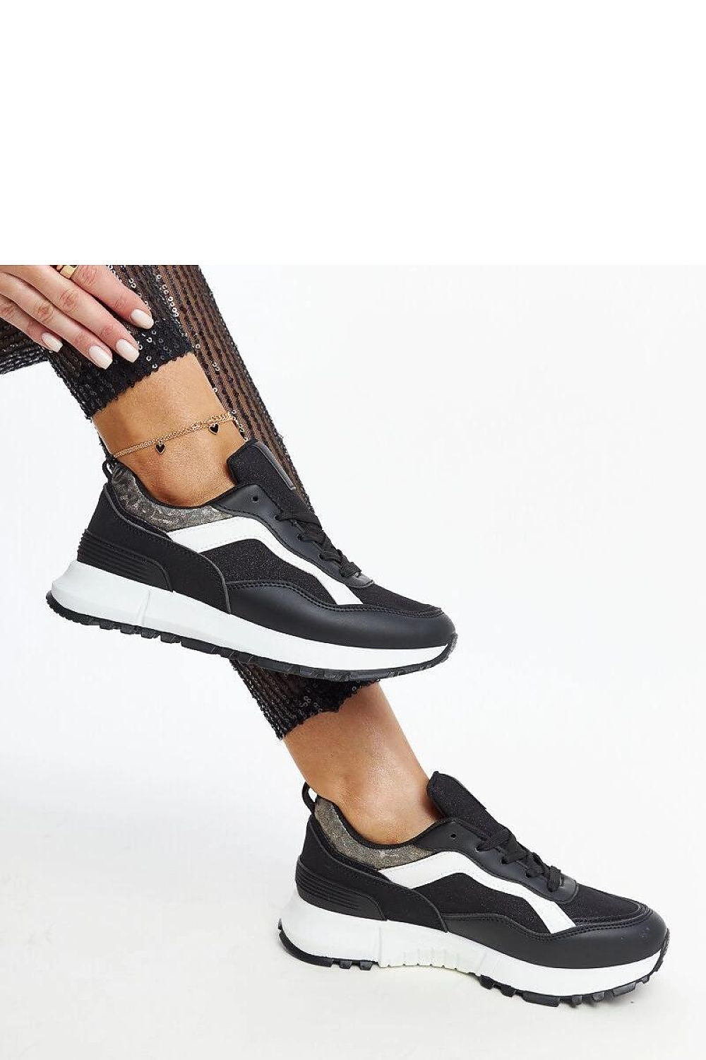 Close-up of Solea black glitter sneakers, showcasing the high-quality materials and elegant glitter detailing.