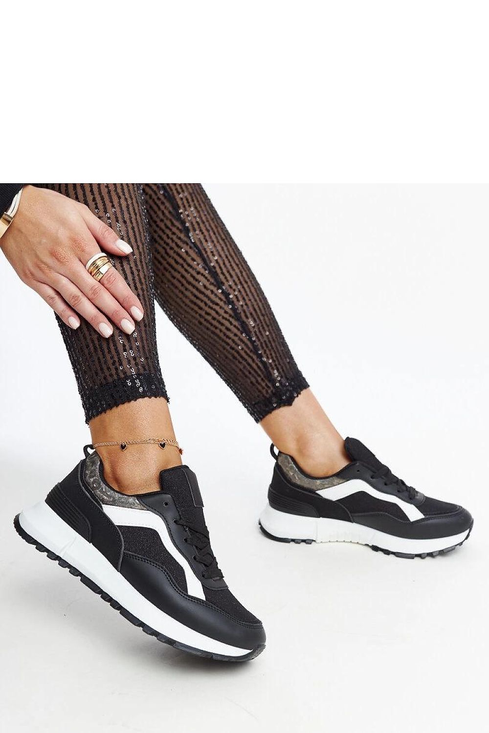 Solea Evelia platform sneakers displayed on a chic surface, highlighting their fashionable silhouette and comfortable structure.