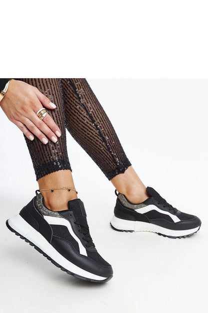 Solea Evelia platform sneakers displayed on a chic surface, highlighting their fashionable silhouette and comfortable structure.