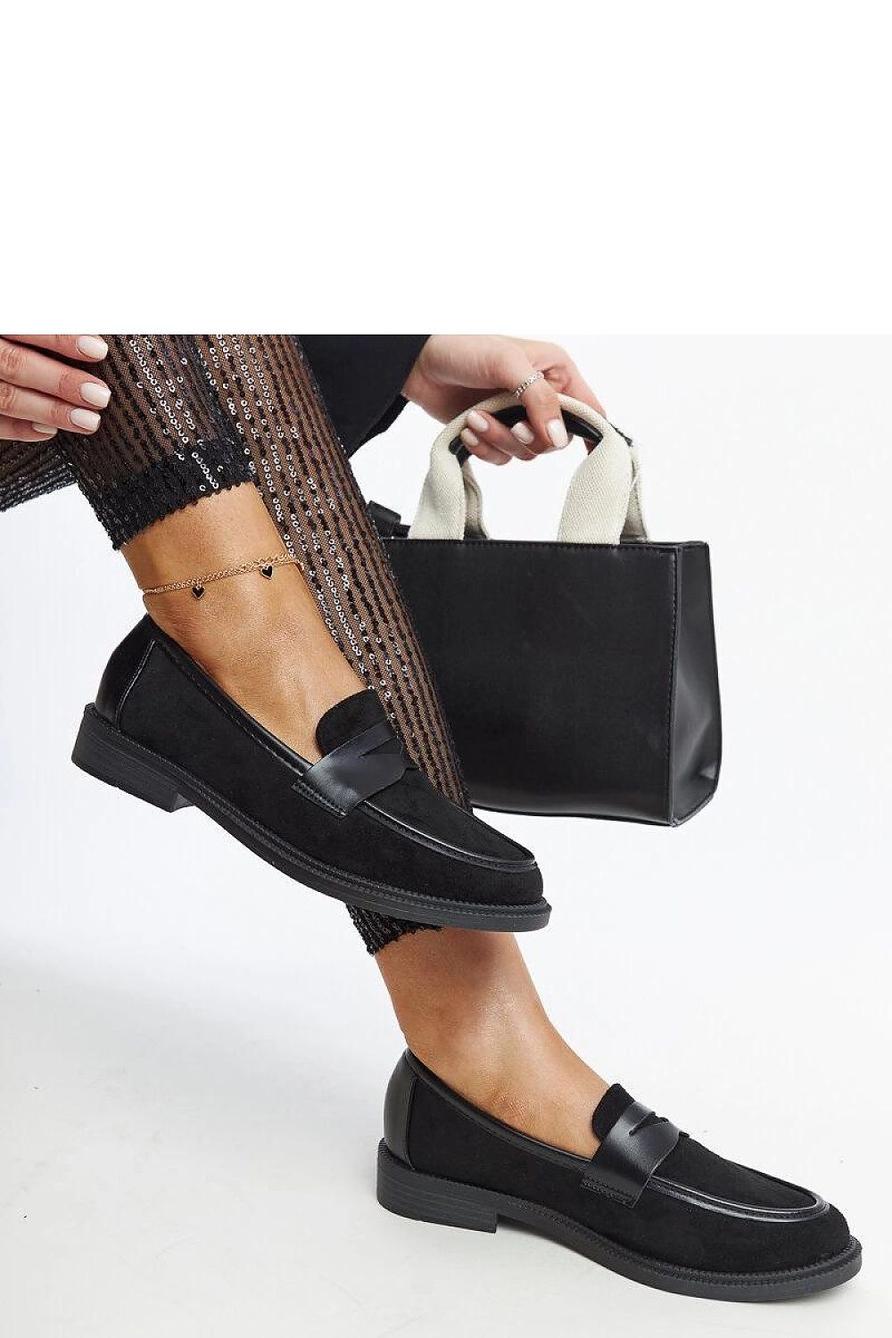 Close-up view of Solea black suede moccasins, featuring a stylish square toe and lightweight design, ideal for comfort and elegance.