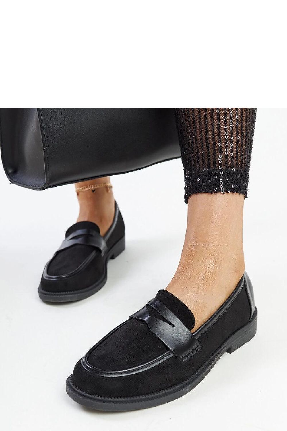 Stylish ensemble featuring Solea black suede moccasins, highlighting their eco-friendly leather craftsmanship and summer versatility.