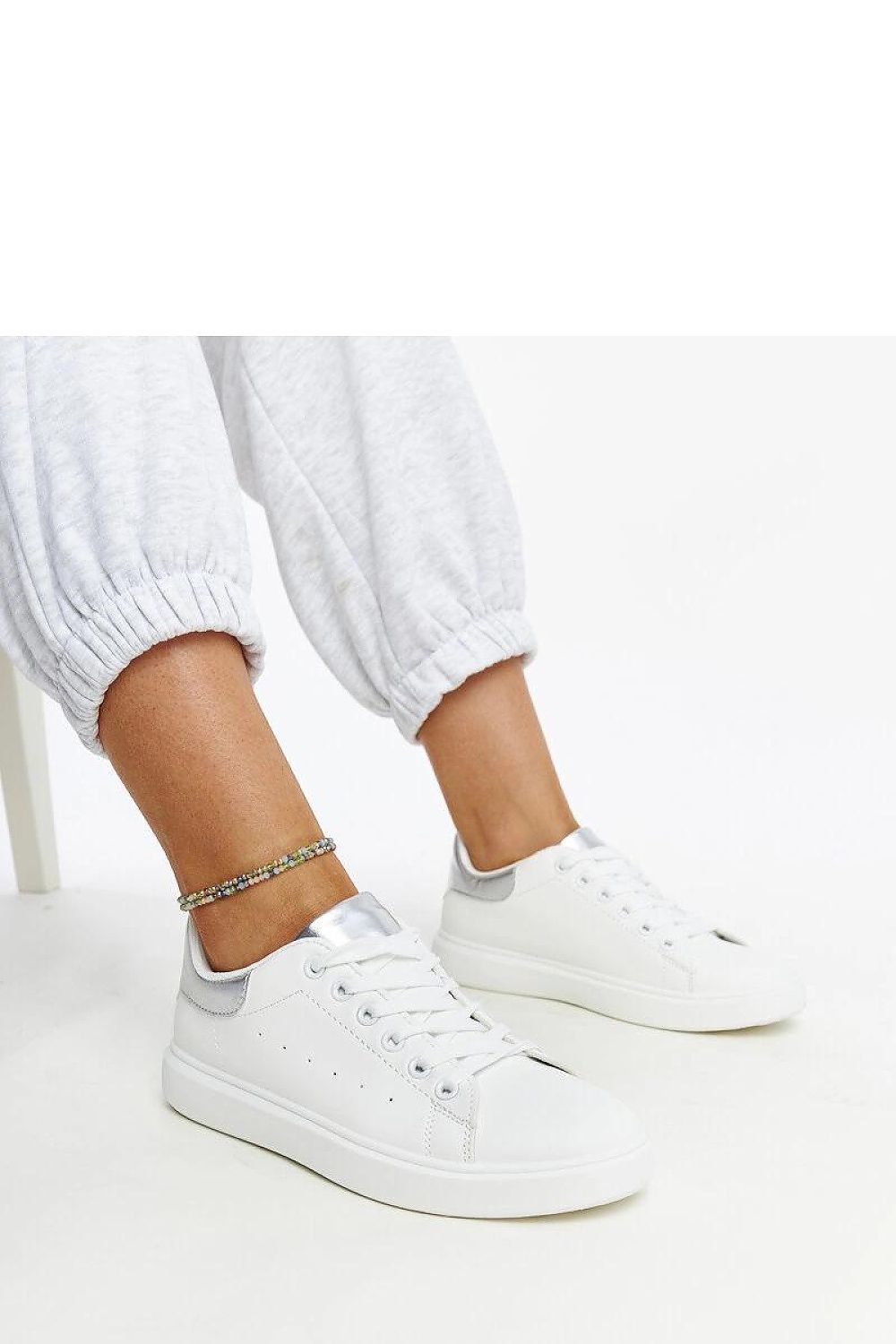 Luxury white platform sneakers by Solea, featuring eco leather design and silver accents, perfect for stylish summer outings.