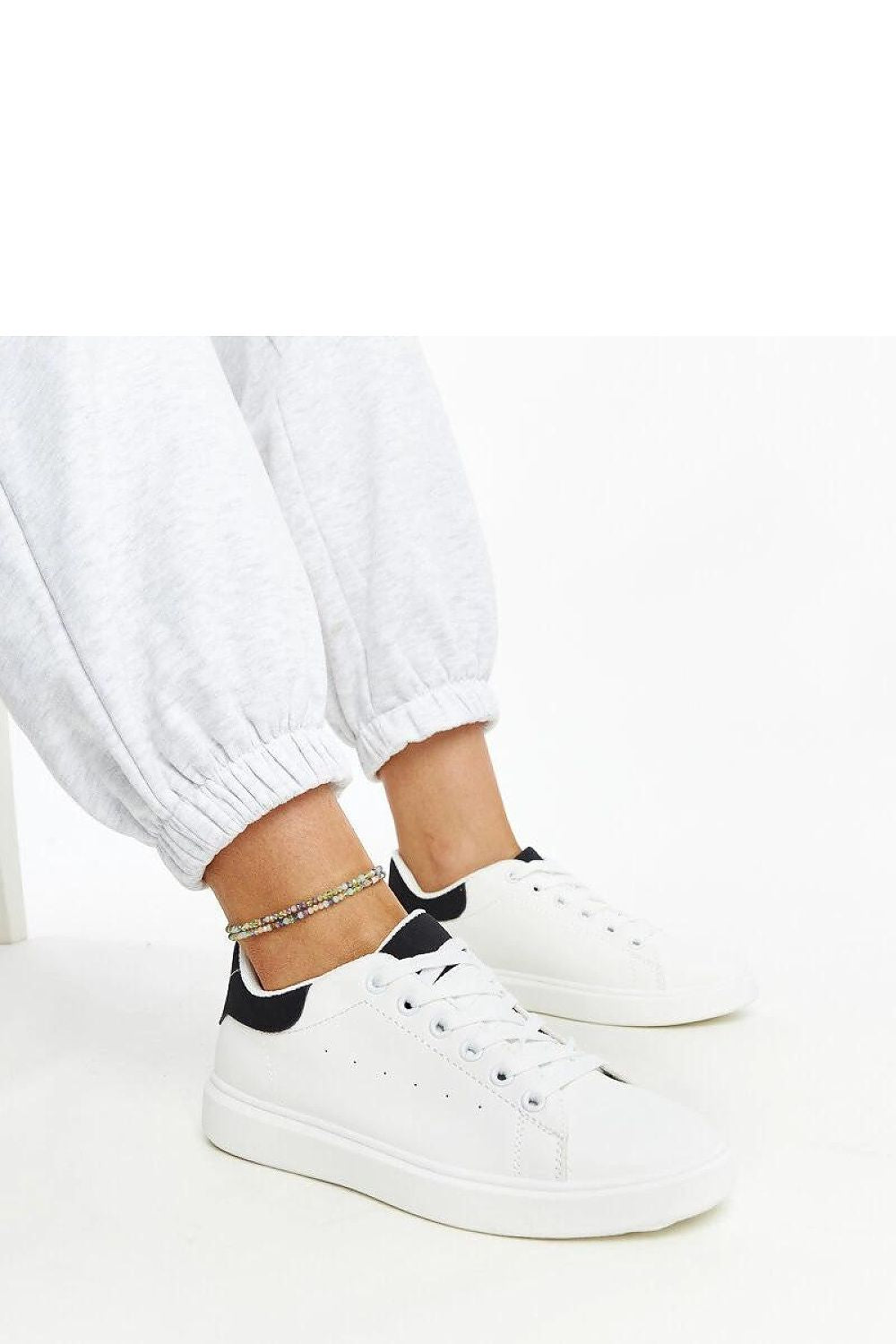 Close-up of Solea luxury white platform sneakers, featuring a lace-up design and eco leather finishing for ultimate comfort.