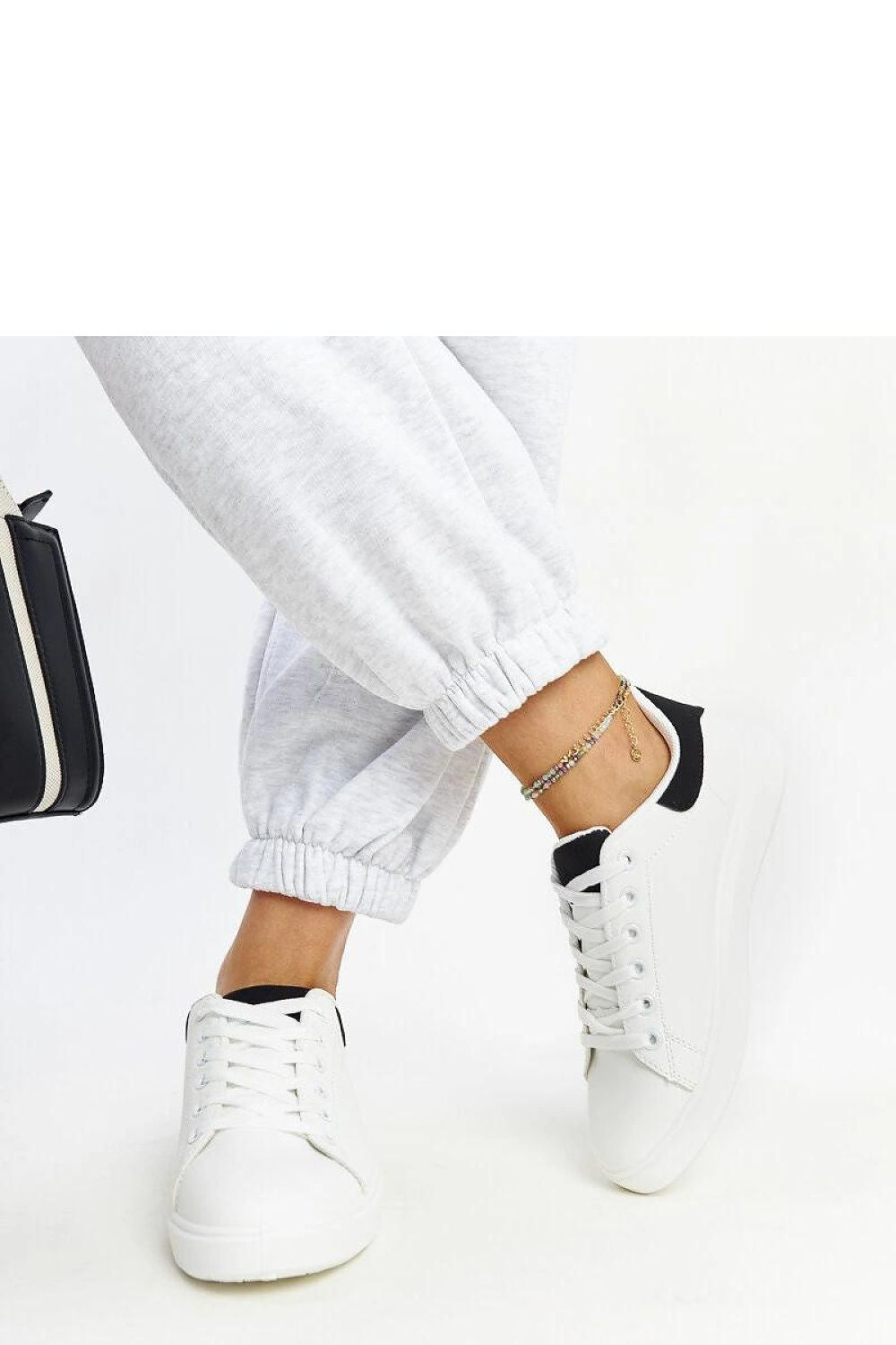 Solea's luxury white platform sneakers highlighted against a chic background, embodying modern elegance and eco-friendly design.