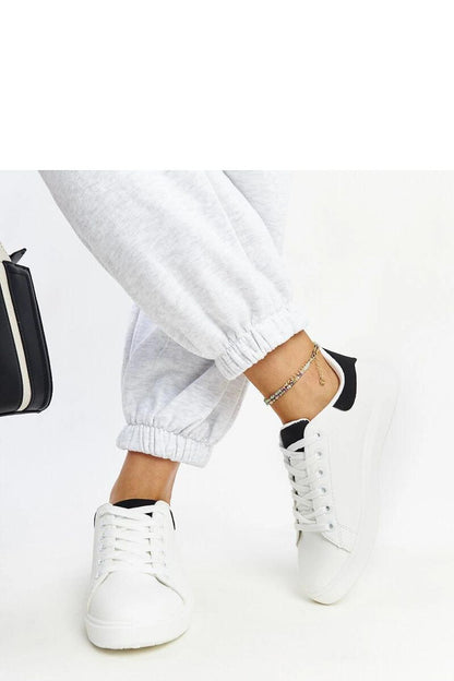 Solea's luxury white platform sneakers highlighted against a chic background, embodying modern elegance and eco-friendly design.