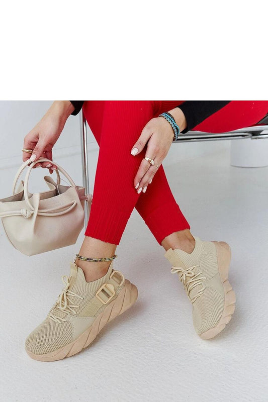 Solea Faruz sports sneakers in fashionable beige, showcasing a comfortable lace-up design for optimum fit.