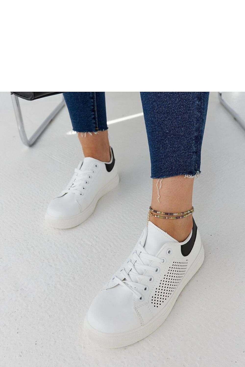 Close-up view of Solea luxury white openwork sneakers Semhar featuring high-quality eco leather and a stylish lace closure, ideal for casual summer looks.