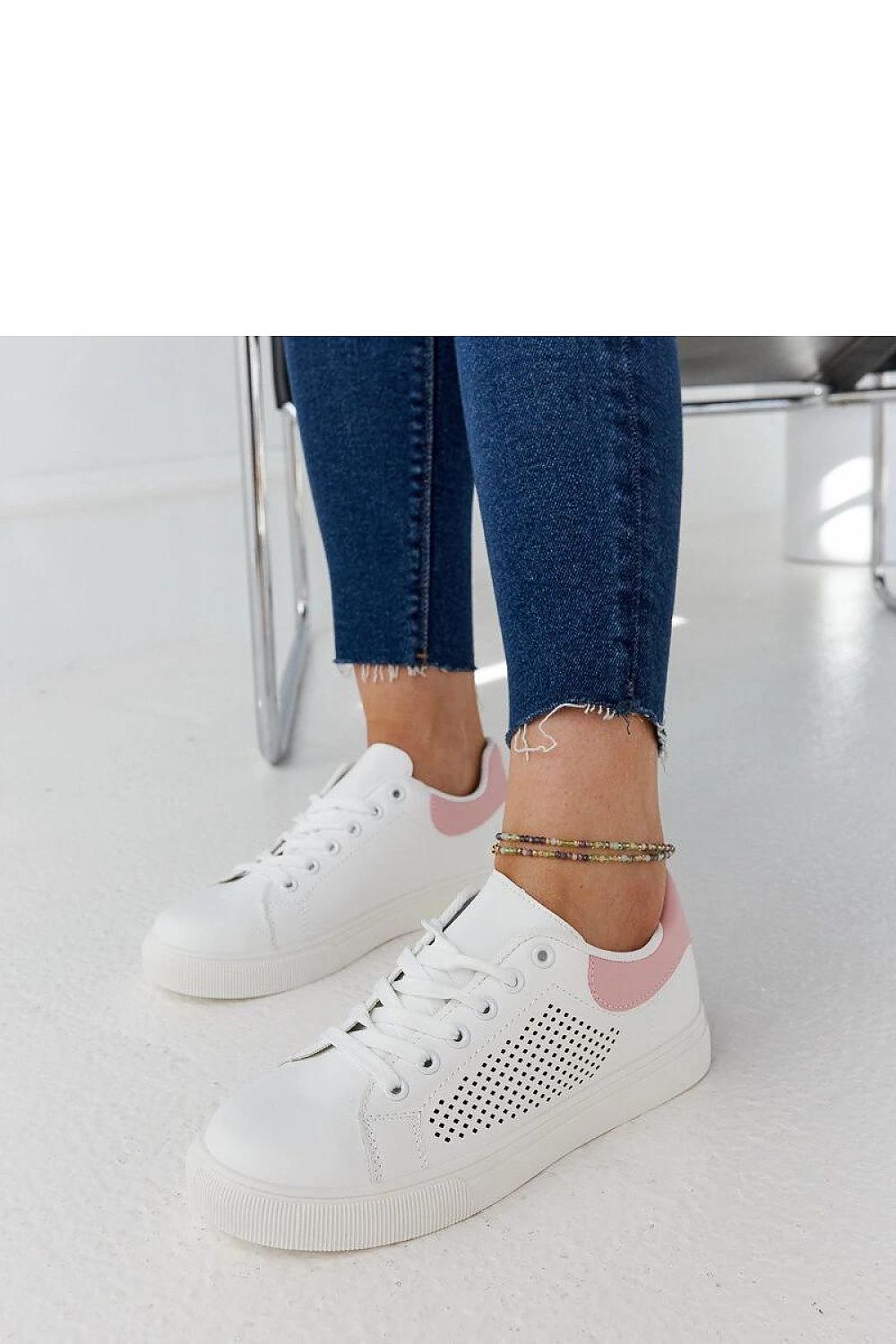 Luxury white openwork sneakers Semhar by Solea, crafted in eco leather for a chic summer look. Perfectly styled with a sleek lace closure and lightweight rubber sole.