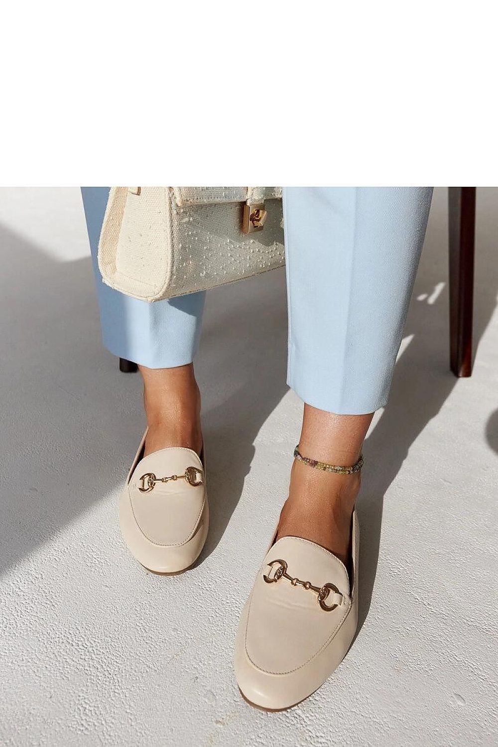 Close-up of Solea Erminia eco-leather loafers, highlighting the sophisticated buckle detail and sleek almond toe, ideal for a fashionable, comfortable summer look.