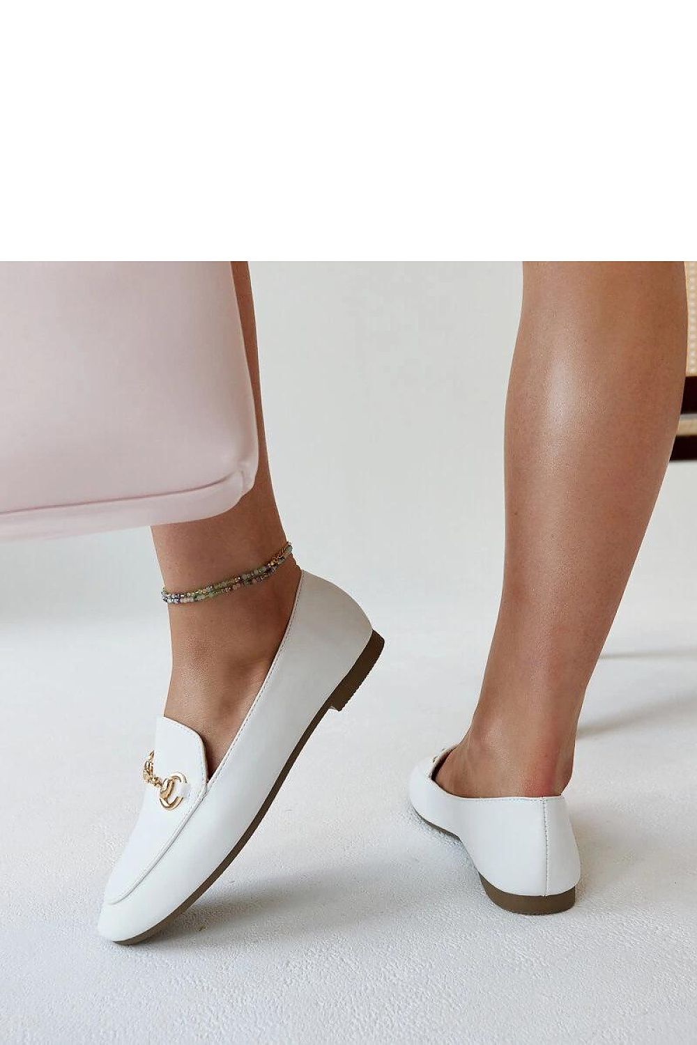 Classy Solea Erminia loafers crafted from premium eco-leather, highlighted with a fashionable buckle, designed for comfort and sophistication.